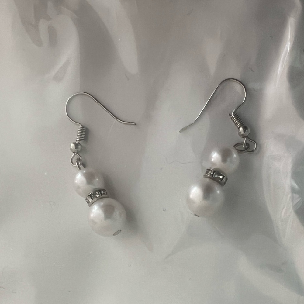 Faux pearl and silver tone earrings